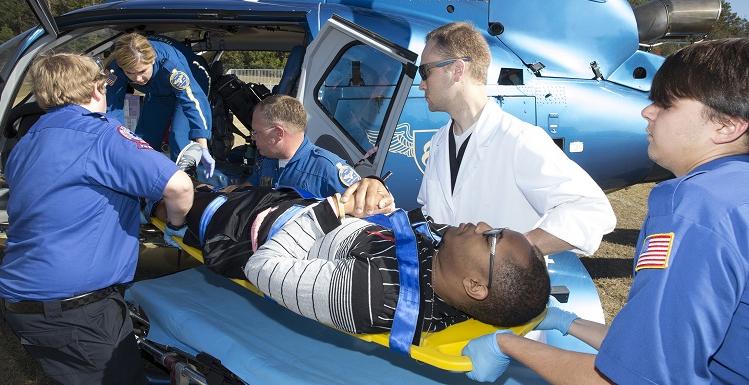 南 students in the emergency medical services program load a "victim" onto a helicopter for treatment at a local hospital during an annual disaster drill held Thursday on campus.
